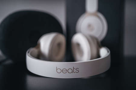 London | UK - 2021.10.09: Close up product photos of ivory Beats Solo Pro wireless bluetooth on-ear headphones with active noise cancelling on black deskのeditorial素材