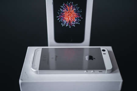 London | UK - 2021.10.09: Close up product photos of Iphone SE in silver color sealed in plastic on boxのeditorial素材