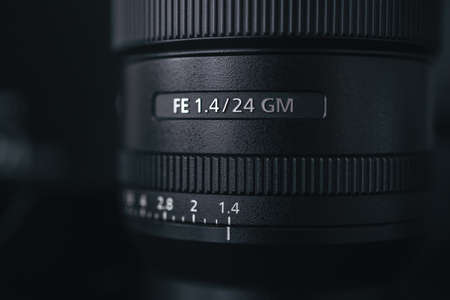 London | UK - 2021.10.09: Close up product photos of Sony FE 24mm F1.4 GM lens on black deskのeditorial素材