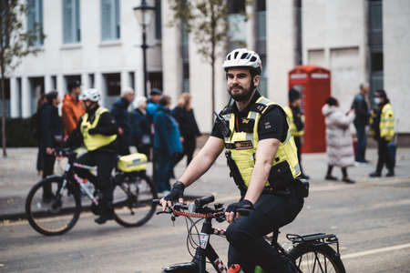 London, UK - 2021.11.13: Metropolitan police officers on bicycles at the Lord Mayor of London show paradeのeditorial素材
