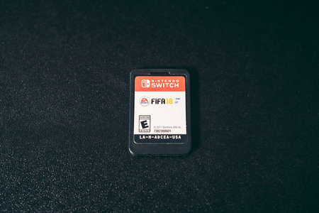 London, UK - 2021.11.27: Product close-up shot of Nintendo Switch Game Card Fifa 2018のeditorial素材