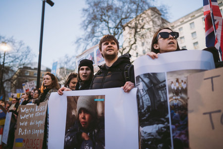 Downing Street, London | UK -  2022.02.25: Ukrainian people protest, thousands gather to demand...