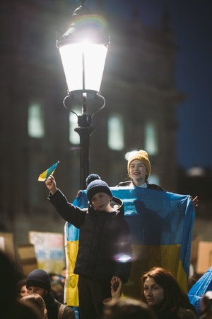 Downing Street, London | UK -  2022.02.25: Ukrainian kids with flags protest, thousands gather to...