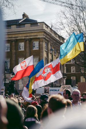 Downing Street, London | UK -  2022.02.26: Ukrainian people protest, thousands gather to demand...