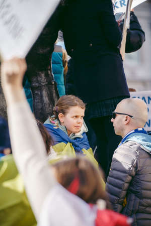 Downing Street, London | UK -  2022.02.26: Young ukrainian children with flags gather to demand tougher sanctions on Russia from British Government to stop war in Ukraineのeditorial素材