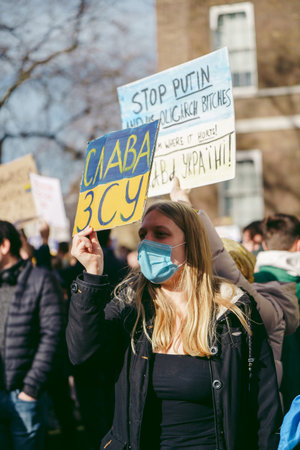 Downing Street, London | UK -  2022.02.26: Ukrainian people protest, thousands gather to demand...