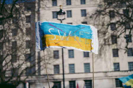 Downing Street, London | UK -  2022.02.26: Ukrainian people protest, thousands gather to demand tougher sanctions on Russia from British Government, EU and USA to stop the war in Ukraineのeditorial素材