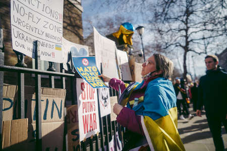 Downing Street, London | UK -  2022.02.26: Ukrainian people protest, thousands gather to demand tougher sanctions on Russia from British Government, EU and USA to stop the war in Ukraineのeditorial素材