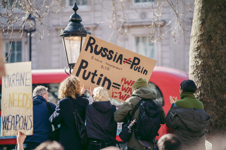 Downing Street, London | UK -  2022.02.26: Ukrainian people protest, thousands gather to demand...