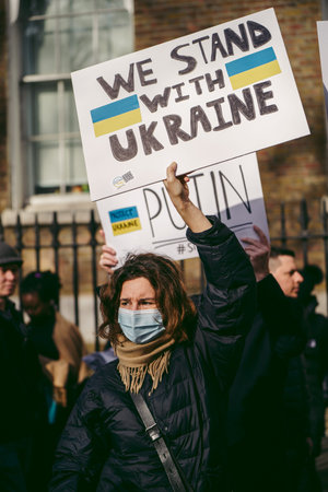 Downing Street, London | UK -  2022.02.26: Ukrainian people protest, thousands gather to demand tougher sanctions on Russia from British Government, EU and USA to stop the war in Ukraineのeditorial素材