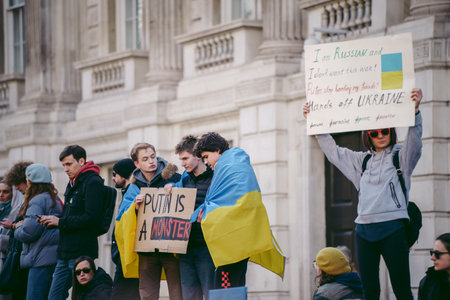 Downing Street, London | UK -  2022.02.26: Ukrainian people protest, thousands gather to demand...