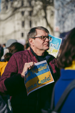 Downing Street, London | UK -  2022.02.26: Ukrainian people protest, thousands gather to demand...