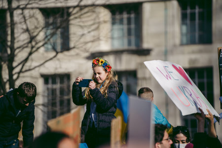 Downing Street, London | UK -  2022.02.26: Young ukrainian children with flags gather to demand...