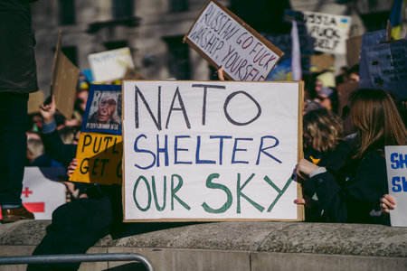 Downing Street, London | UK -  2022.02.26: Ukrainian people protest, thousands gather to demand...