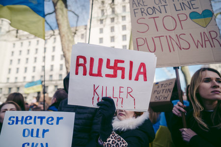Downing Street, London | UK -  2022.02.26: Ukrainian people protest, thousands gather to demand...