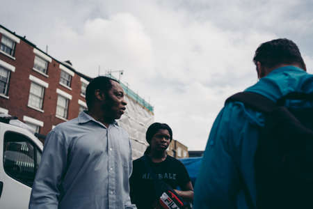 Brick Lane, East London / UK -  2020.08.16: People buying and selling different items stuff at at Vintage Marketのeditorial素材