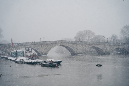 Richmond Upon Thames, London | UK -  2021.01.24: Richmond Bridge on cold snowy winter Sunday