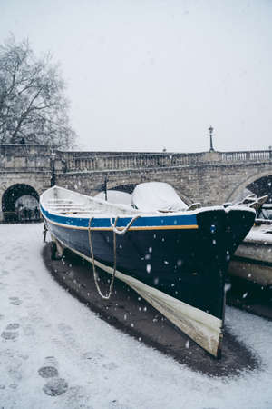 Richmond Upon Thames, London | UK -  2021.01.24: Boats covered in snow and moored on the river in West part of the cityのeditorial素材