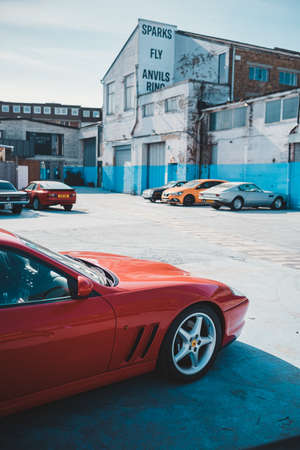 Brentford, West London | UK -  2021.03.21: Red Ferrari 550 Maranello parked at th Brentford Project parking on sunny spring dayのeditorial素材