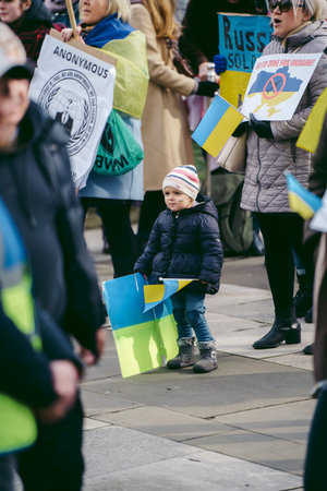 Parliament Square, London | UK -  2022.03.06: Young children with flags and banners gather to demand tougher sanctions on Russia from British Governmentのeditorial素材