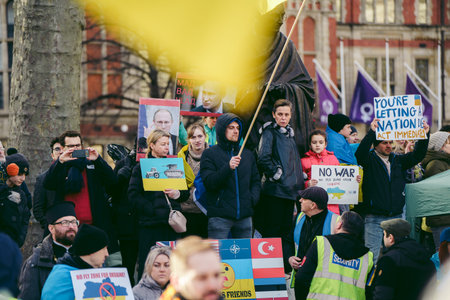 Parliament Square, London | UK -  2022.03.06: Ukrainian people protest, thousands gather to demand...