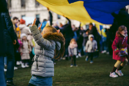Parliament Square, London | UK -  2022.03.06: Young children with flags and banners gather to demand tougher sanctions on Russia from British Governmentのeditorial素材