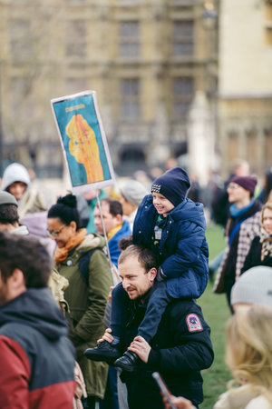 Parliament Square, London | UK -  2022.03.06: Young children with flags and banners gather to demand...
