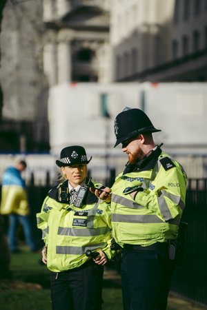 Downing Street, London | UK -  2022.03.12: Ukrainian people protest, thousands gather to demand...