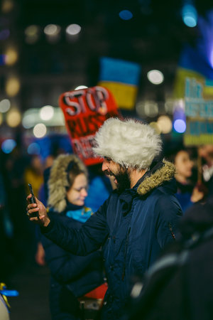 Trafalgar Square, London | UK -  2022.03.08: Ukrainian people protest, thousands gather to demand...