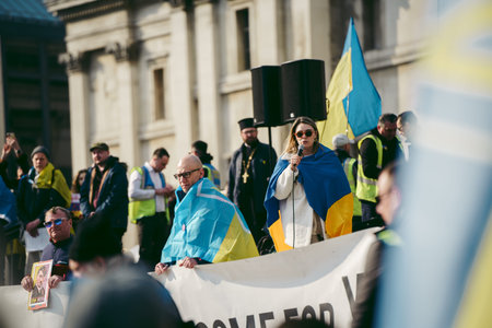 Trafalgar Square, London | UK -  2022.03.20: Ukrainian people protest, thousands gather to demand...