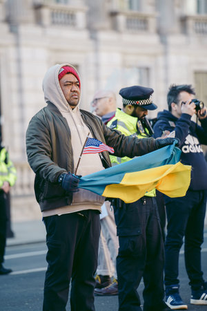 Downing Street, London | UK -  2022.03.19: Ukrainian people protest, thousands gather to demand...