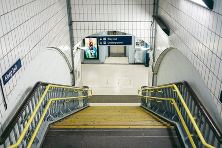 London | UK -  2022.04.16: Going down the stairs at empty Vauxhall station
