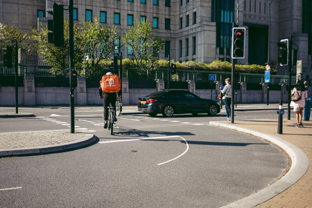 London | UK -  2022.04.16: Just Eat Cyclist on London streets