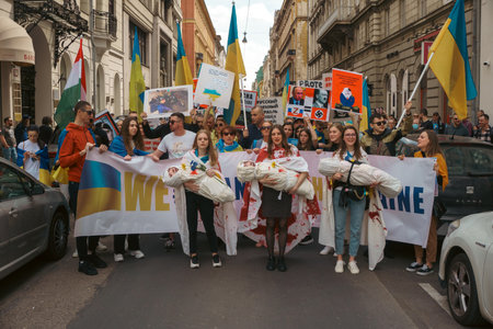 Budapest | Hungary - 2022.03.08: People with flags in Budapest gather to support Ukrainians and stop the war started by russiaのeditorial素材