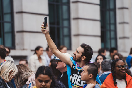 London / UK - 02/07/2022: People with flags and banners celebrating London LGBTQ Pride Paradeのeditorial素材