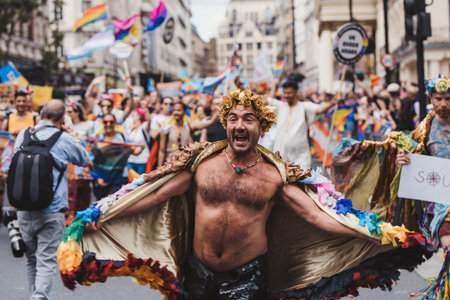 London / UK - 02/07/2022: People with flags and banners celebrating London LGBTQ Pride Paradeのeditorial素材