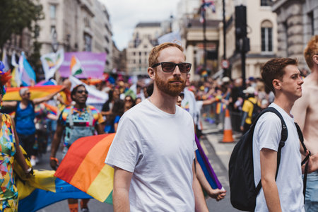 London / UK - 02/07/2022: People with flags and banners celebrating London LGBTQ Pride Paradeのeditorial素材