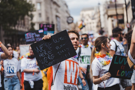 London / UK - 02/07/2022: People with flags and banners celebrating London LGBTQ Pride Paradeのeditorial素材