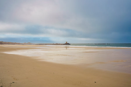 Beautiful view of La Rocco Tower on sunrise from the Le Braye Beachの写真素材