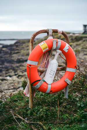 Lifebuoy at the seaside on cloudy dayのeditorial素材