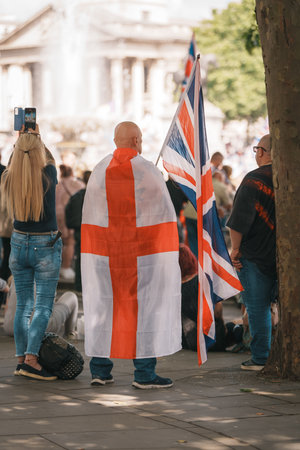 Trafalgar Square, London - UK - 2024.07.27: People with British flags are gathering at the March for Freedom, March for Britainのeditorial素材