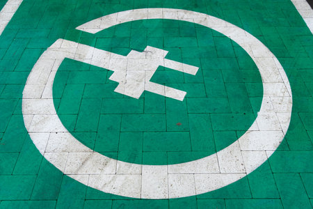 A dedicated charging spot marked with a prominent electric symbol showcases the shift towards modern...