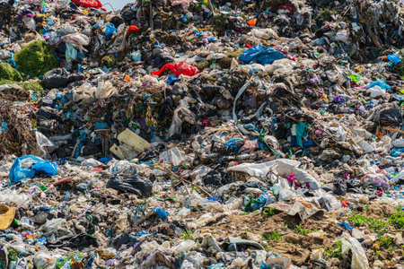 Pile of domestic garbage in landfill dump site. Global environmental issue of waste disposal.