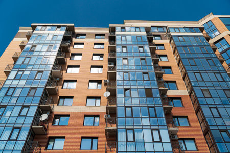 Modern apartment buildings on a sunny day with a blue sky.の写真素材