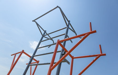 Colorful climbing structure attracts children to play while under a clear blue sky on a beautiful...