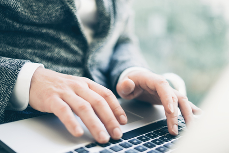 Businesman works with laptopの写真素材