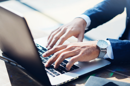 Businesman works with laptopの写真素材