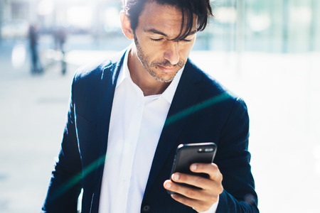 Man with smartphone outdoorの写真素材
