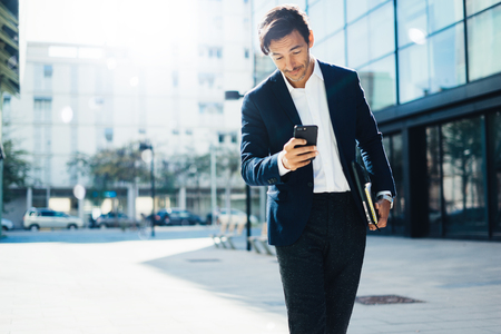 Man with smartphone outdoorの写真素材