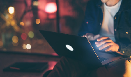 Man with laptop at nightの写真素材
